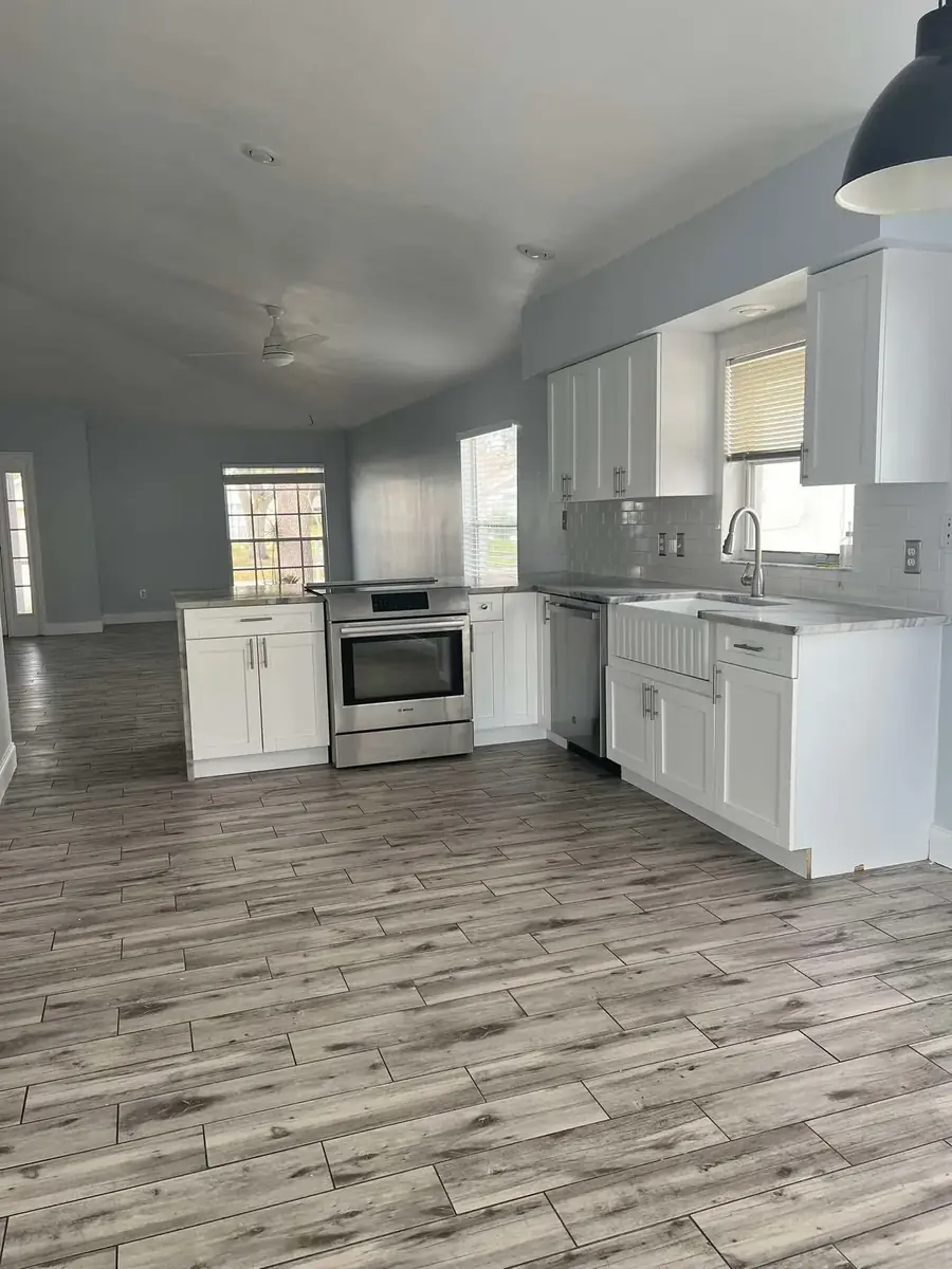 Spotless white kitchen after recurring cleaning service in Tampa Bay